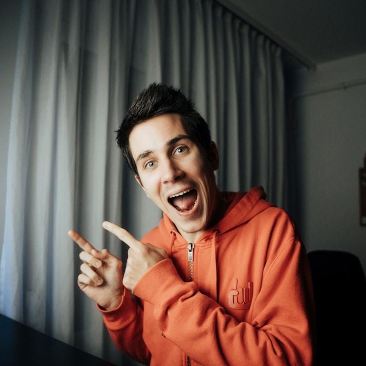 Amira Rao, Lead Design Curator at IsleQuarryReed, reviewing corporate floral arrangements